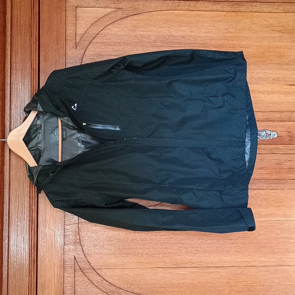 Lightweight black rain jacket with green dots, size S